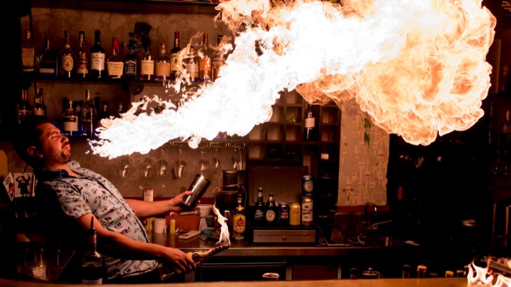 Fire breathed across the bar